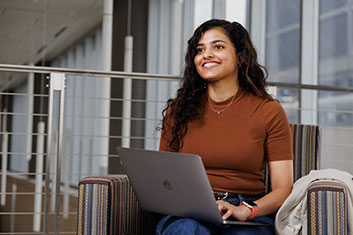 A student smiling. Links to Gifts That Protect Your Assets