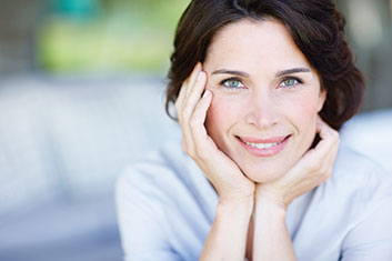 Photo of a smiling woman. Link to Life Stage Gift Planner Under Age 60 Situations.