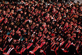 Graduate students at graduation. Links to Gifts of Cash, Checks, and Credit Cards
