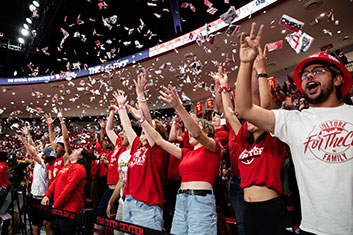 Students cheering. Links to Gifts That Pay You Income